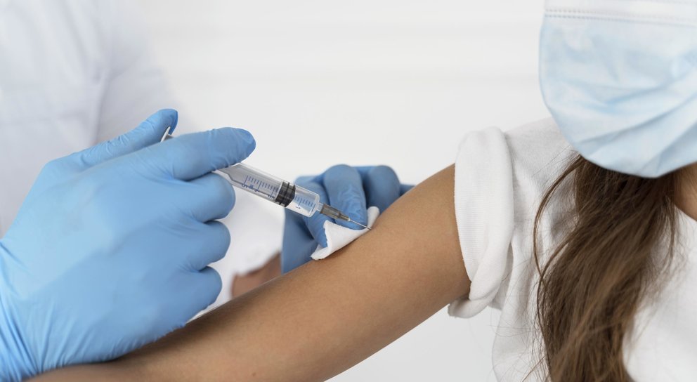 close-up-of-male-doctor-vaccinating-girl
